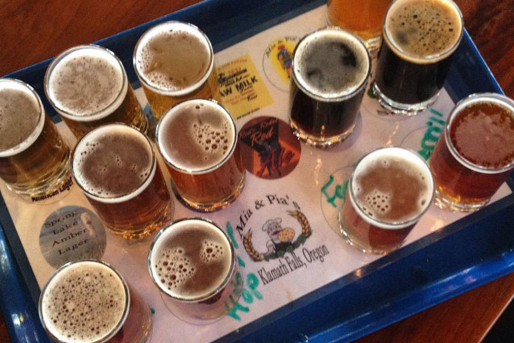 Flight of beer on a tray at Mia & Pia's Brewhouse.