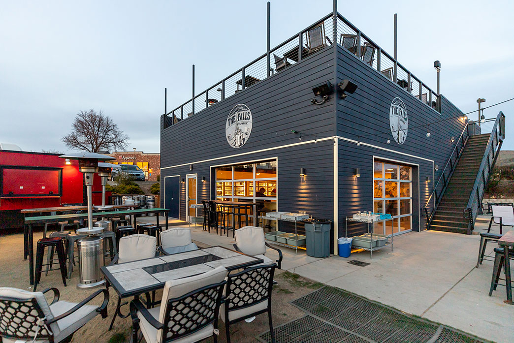 The Falls Taphouse blue building with indoor and outdoor seating to enjoy a beer.