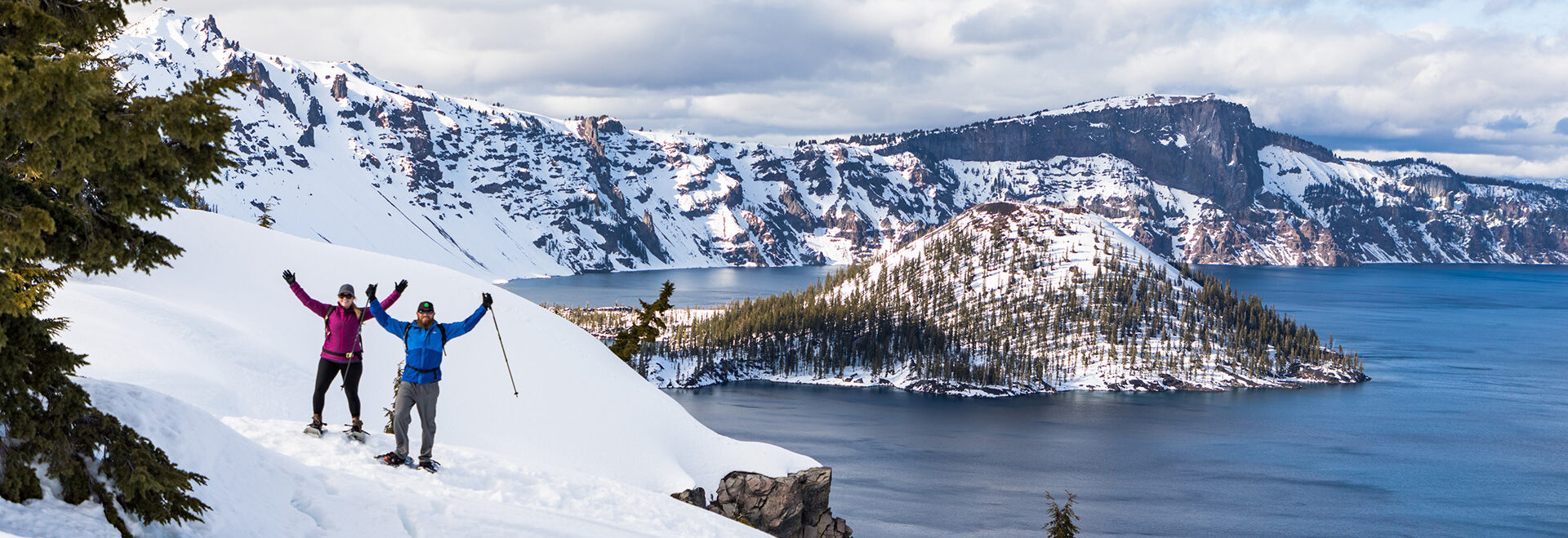 Snowshoers on the rim of Crater Lake at Crater Lake National Park.